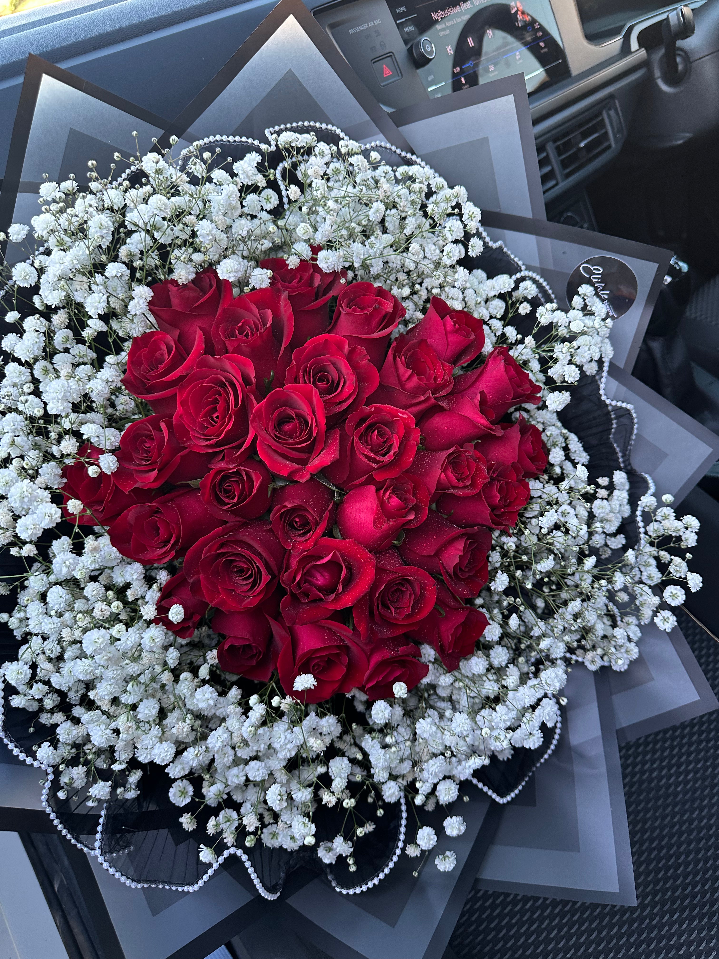 Red roses with baby's breath